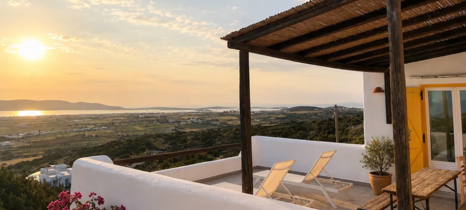 Sun loungers on the terrace at Milos House at golden hour